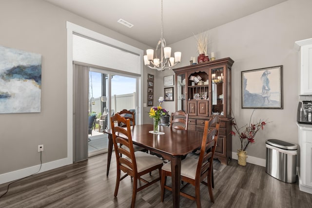 1473 W Jay Ct, Spokane, WA 99208 - dining room with a chandelier, dark wood finished floors, and baseboards