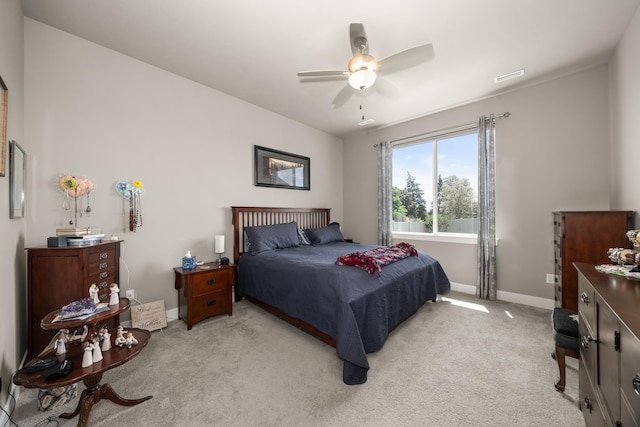 1473 W Jay Ct, Spokane, WA 99208 - bedroom with baseboards, light colored carpet, and a ceiling fan