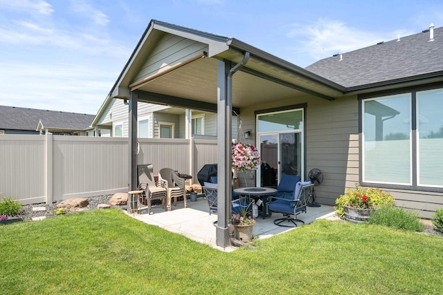 1473 W Jay Ct, Spokane, WA 99208 - back of property with a patio area and roof with shingles
