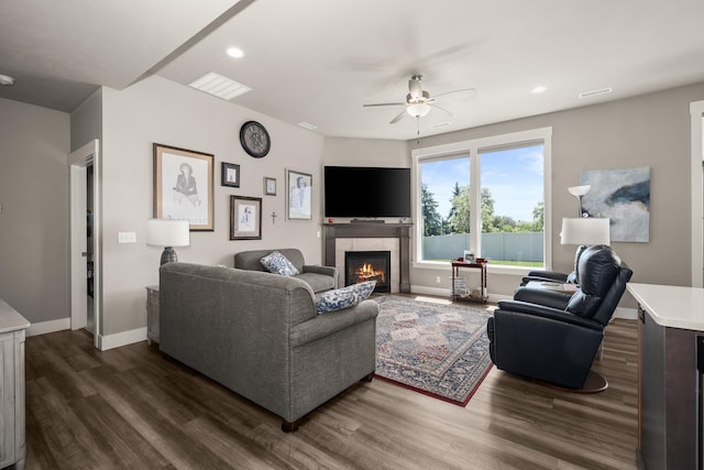 1473 W Jay Ct, Spokane, WA 99208 - living room featuring dark wood-style floors, a fireplace, a ceiling fan, recessed lighting, and baseboards