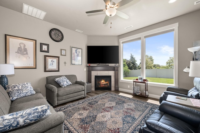1473 W Jay Ct, Spokane, WA 99208 - living area with wood finished floors, a tile fireplace, and ceiling fan
