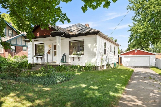 967 E 13th Ave, Spokane, WA 99202 - view of front facade with a chimney, an outdoor structure, a porch, a garage, and a front yard