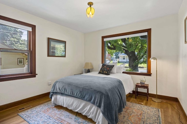 967 E 13th Ave, Spokane, WA 99202 - bedroom featuring baseboards and wood finished floors