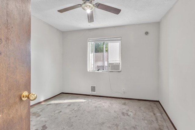 3228 E 29th Ave, Spokane, WA 99223 - carpeted empty room featuring ceiling fan, baseboards, cooling unit, and a textured ceiling