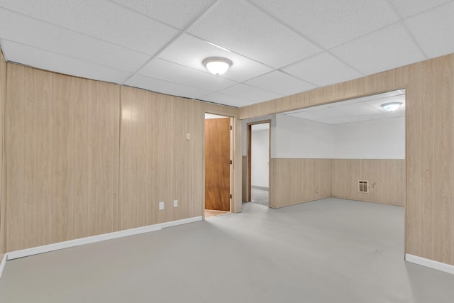 3228 E 29th Ave, Spokane, WA 99223 - finished basement with wood walls, a paneled ceiling, and baseboards