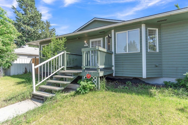 3228 E 29th Ave, Spokane, WA 99223 - view of front of house with a front yard and a wooden deck