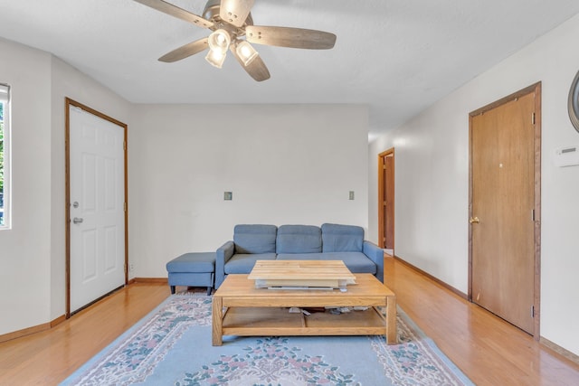 3228 E 29th Ave, Spokane, WA 99223 - living area with light wood-style floors, a ceiling fan, and baseboards