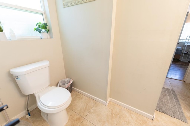 2002 15th Ave, Spokane, WA 99203 - bathroom featuring tile patterned floors, toilet, and baseboards