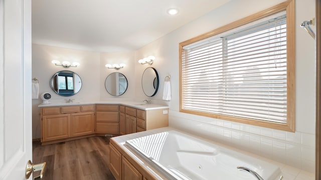 6314 W Skagit Ave, Spokane, WA 99208 - full bath with a jetted tub, double vanity, and wood finished floors