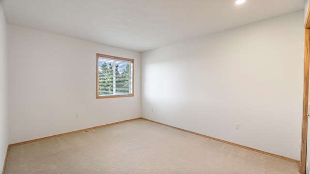 6314 W Skagit Ave, Spokane, WA 99208 - empty room featuring light carpet, baseboards, and recessed lighting