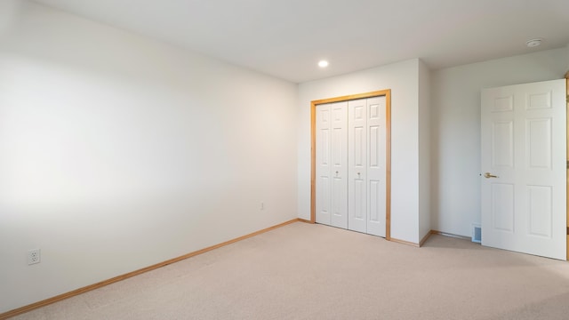 6314 W Skagit Ave, Spokane, WA 99208 - unfurnished bedroom with light colored carpet, baseboards, a closet, and recessed lighting
