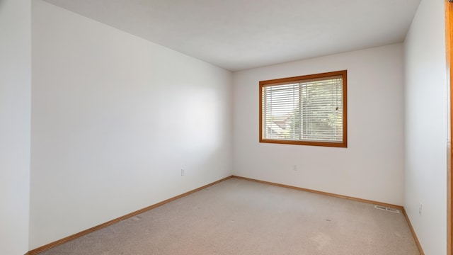 6314 W Skagit Ave, Spokane, WA 99208 - spare room featuring light colored carpet and baseboards