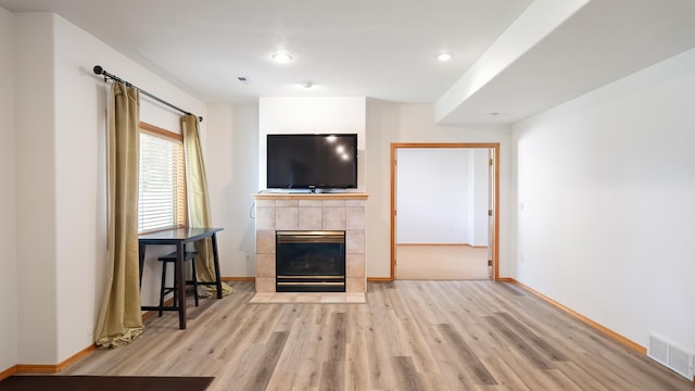 6314 W Skagit Ave, Spokane, WA 99208 - unfurnished living room featuring wood finished floors, baseboards, and recessed lighting