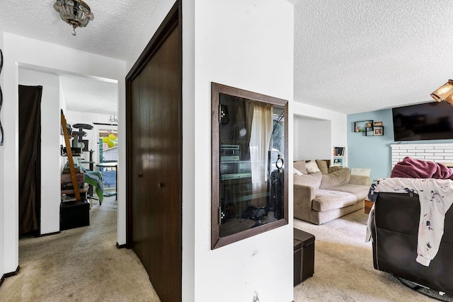 4405 E 46th Ave, Spokane, WA 99223 - corridor with light colored carpet and a textured ceiling