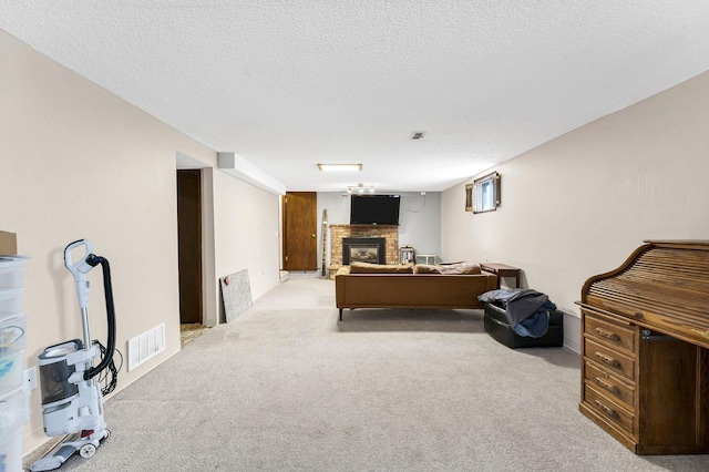 4405 E 46th Ave, Spokane, WA 99223 - living room featuring a brick fireplace, carpet floors, and a textured ceiling
