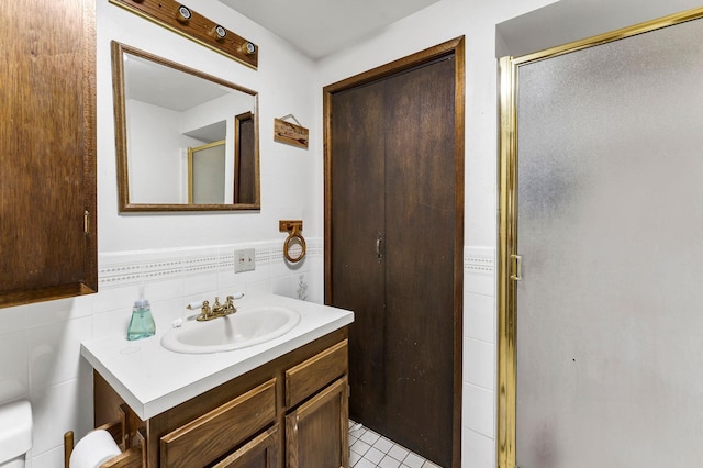 4405 E 46th Ave, Spokane, WA 99223 - full bathroom featuring vanity, a stall shower, and tile walls