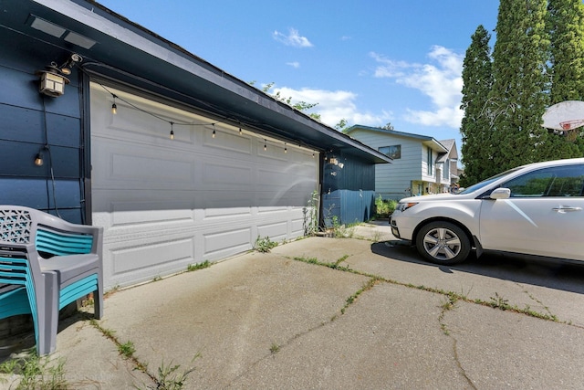 4405 E 46th Ave, Spokane, WA 99223 - view of side of property with a garage and concrete driveway