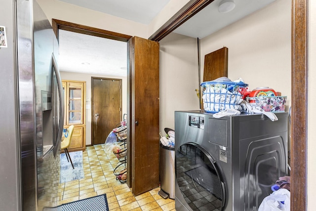 4405 E 46th Ave, Spokane, WA 99223 - laundry area with washer / clothes dryer and light tile patterned floors