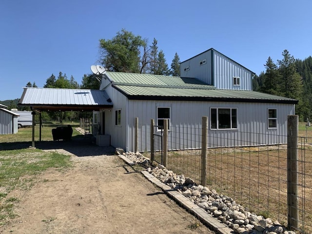 2694B Sand Canyon Rd, Chewelah, WA 99109 - view of side of property with a carport, driveway, and metal roof