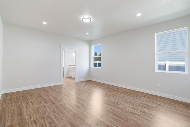 3405 E Yearling Rd, Chattaroy, WA 99003 - unfurnished room with light wood-style floors, baseboards, and recessed lighting