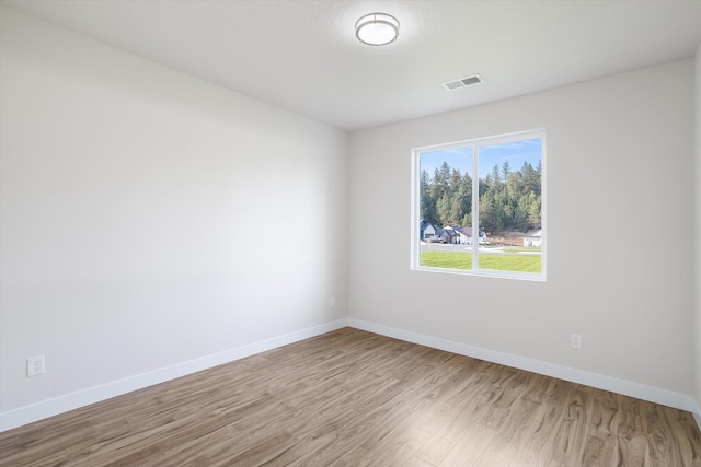 3405 E Yearling Rd, Chattaroy, WA 99003 - empty room with wood finished floors and baseboards