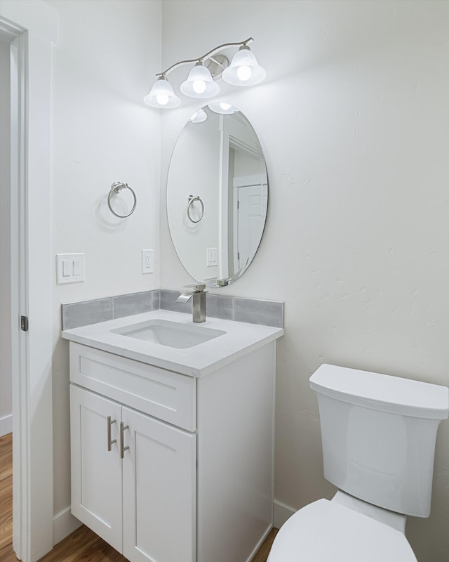 3405 E Yearling Rd, Chattaroy, WA 99003 - bathroom with vanity, toilet, and wood finished floors