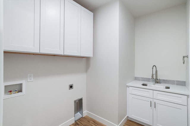 3405 E Yearling Rd, Chattaroy, WA 99003 - laundry area with hookup for an electric dryer, cabinet space, washer hookup, light wood-style floors, and baseboards