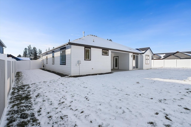 3405 E Yearling Rd, Chattaroy, WA 99003 - snow covered rear of property featuring a fenced backyard