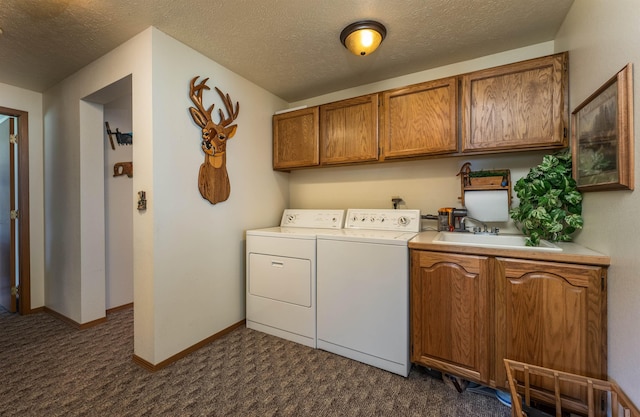 1651 Riverbend Loop Rd, Cusick, WA 99119 - laundry room with cabinet space, washer and clothes dryer, dark carpet, a textured ceiling, and baseboards