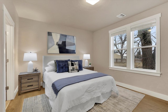 524 N Long Rd, Spokane Valley, WA 99016 - bedroom featuring baseboards and light wood-type flooring