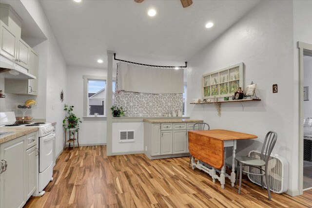 524 N Long Rd, Spokane Valley, WA 99016 - kitchen with white range with electric cooktop, backsplash, light wood-style floors, light countertops, and recessed lighting