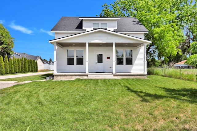 524 N Long Rd, Spokane Valley, WA 99016 - view of front of house with covered porch, a front yard, and roof with shingles