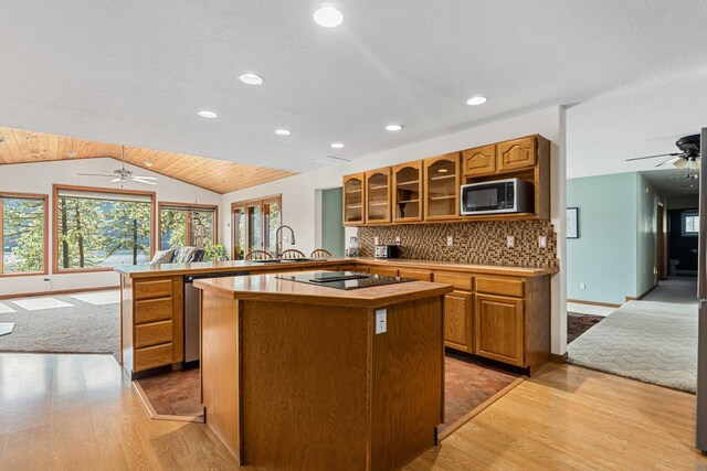 2378 Eagle River Way, Kettle Falls, WA 99141 - kitchen featuring ceiling fan, open floor plan, a peninsula, light wood-type flooring, and black electric cooktop