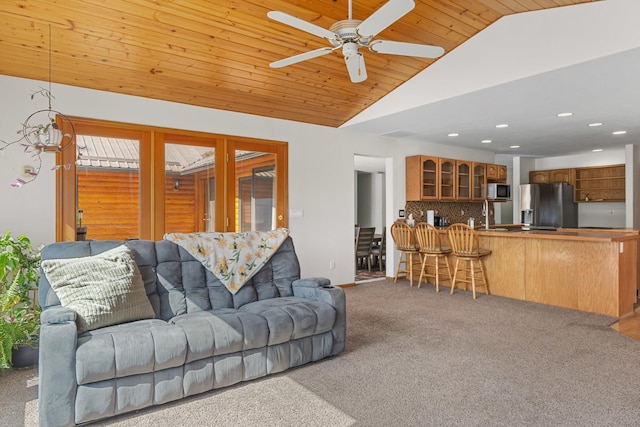 2378 Eagle River Way, Kettle Falls, WA 99141 - carpeted living area featuring vaulted ceiling, ceiling fan, recessed lighting, and wooden ceiling