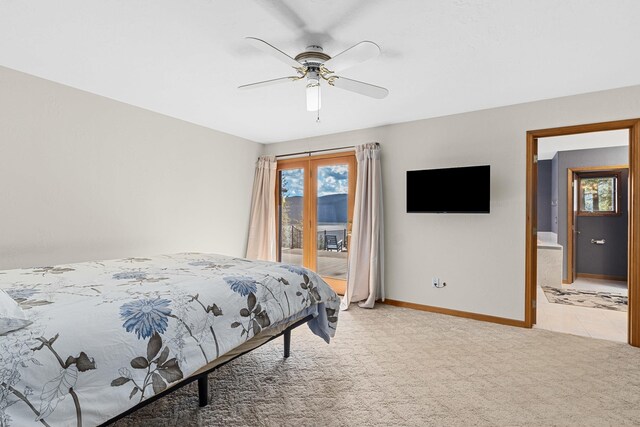 2378 Eagle River Way, Kettle Falls, WA 99141 - bedroom featuring access to exterior, light colored carpet, baseboards, and a ceiling fan