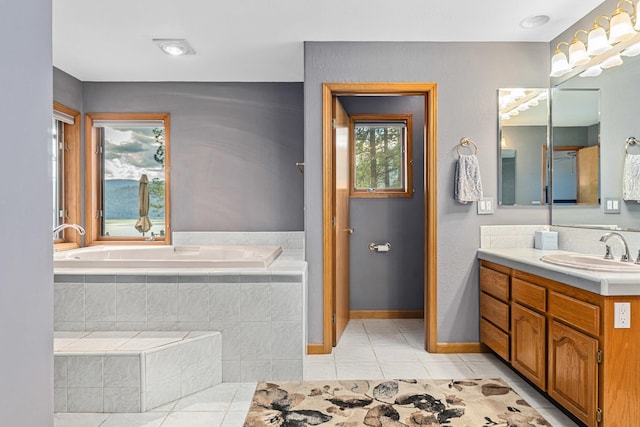 2378 Eagle River Way, Kettle Falls, WA 99141 - full bathroom featuring tile patterned floors, vanity, a garden tub, and baseboards