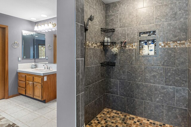 2378 Eagle River Way, Kettle Falls, WA 99141 - bathroom featuring vanity, tiled shower, and tile patterned floors