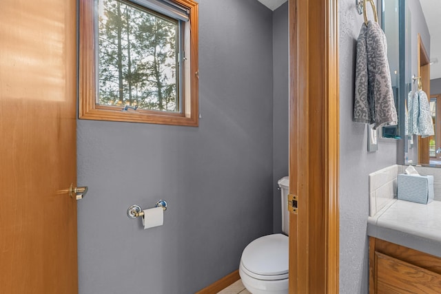 2378 Eagle River Way, Kettle Falls, WA 99141 - bathroom with toilet, vanity, and baseboards