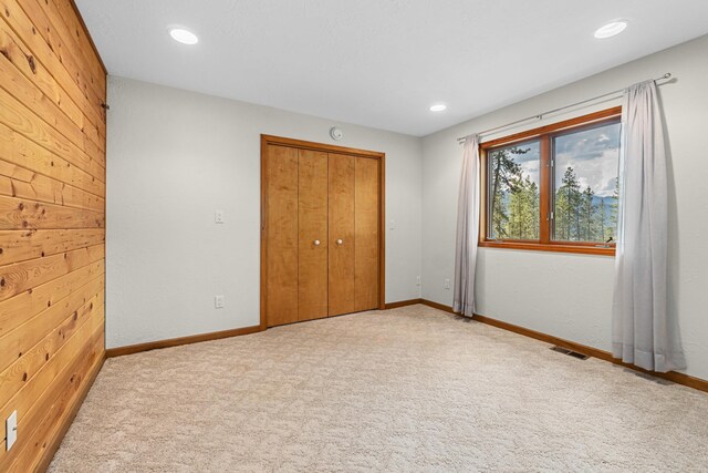 2378 Eagle River Way, Kettle Falls, WA 99141 - unfurnished bedroom with a closet, carpet, recessed lighting, and baseboards