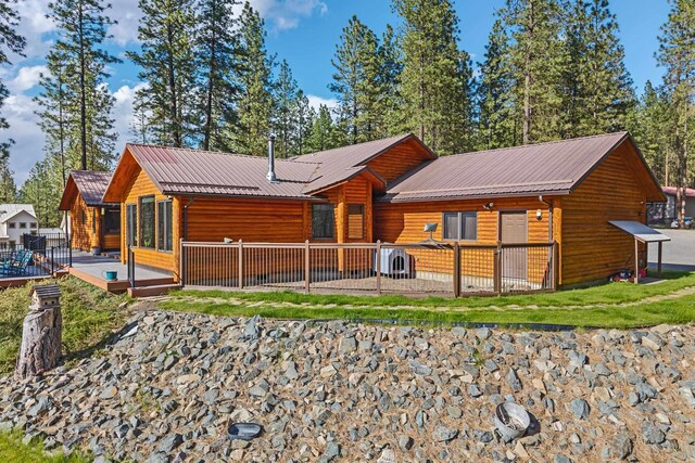 2378 Eagle River Way, Kettle Falls, WA 99141 - rear view of property featuring a wooden deck and metal roof
