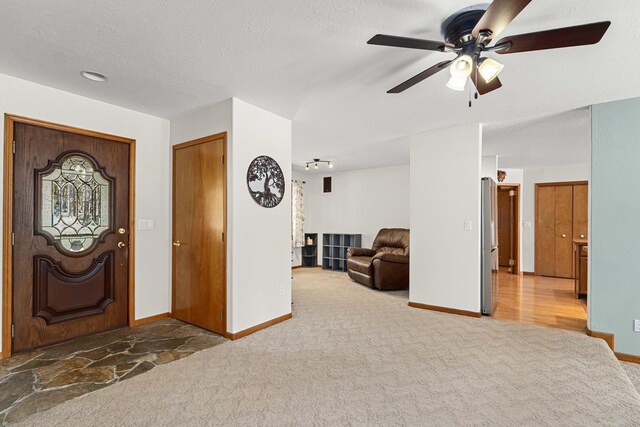 2378 Eagle River Way, Kettle Falls, WA 99141 - entryway featuring carpet, baseboards, and ceiling fan