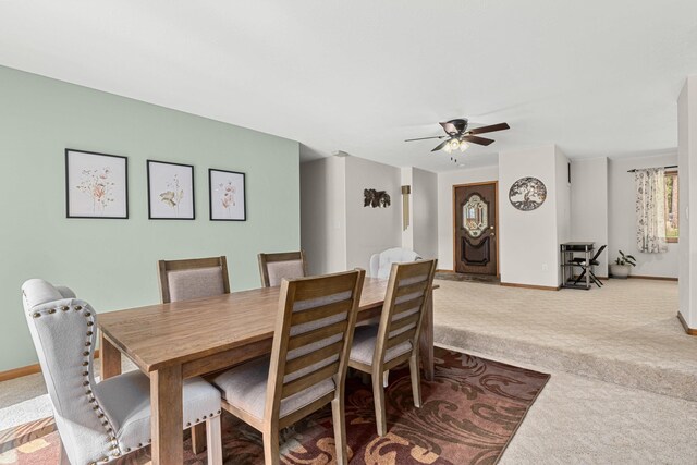 2378 Eagle River Way, Kettle Falls, WA 99141 - dining space with light carpet, a ceiling fan, and baseboards