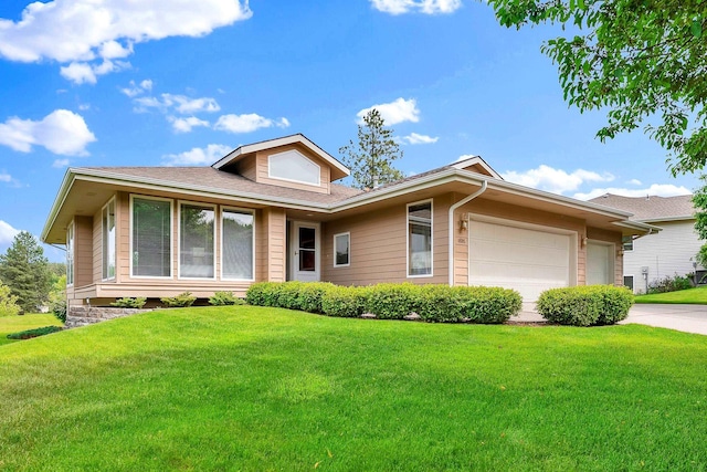 4605 E Birkdale Ln, Spokane, WA 99223 - view of front of property with a garage, a front yard, driveway, and roof with shingles