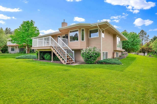 4605 E Birkdale Ln, Spokane, WA 99223 - back of house featuring stairway, a chimney, a yard, and a deck