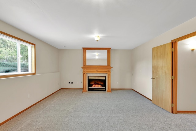 4605 E Birkdale Ln, Spokane, WA 99223 - unfurnished living room with a fireplace, light carpet, and baseboards