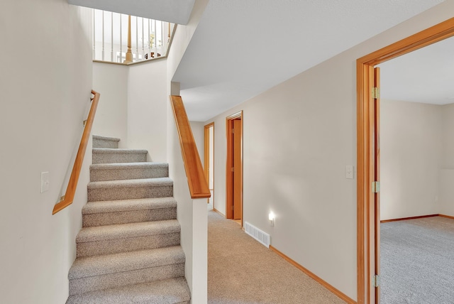 4605 E Birkdale Ln, Spokane, WA 99223 - stairway with carpet flooring and baseboards