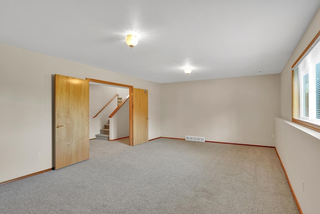4605 E Birkdale Ln, Spokane, WA 99223 - carpeted spare room with stairway and baseboards