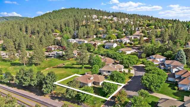 4605 E Birkdale Ln, Spokane, WA 99223 - aerial view of property's location featuring a forest, nearby suburban area, and property boundaries highlighted