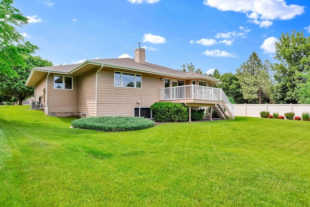 4605 E Birkdale Ln, Spokane, WA 99223 - back of house with stairs, a chimney, a wooden deck, and central AC