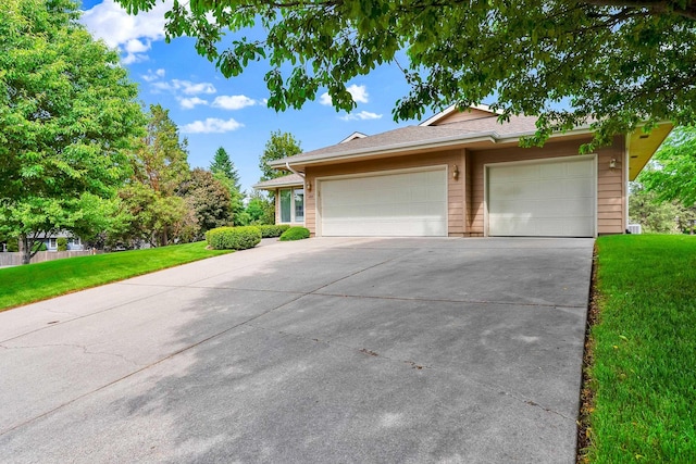 4605 E Birkdale Ln, Spokane, WA 99223 - view of front facade featuring concrete driveway, an attached garage, and a front yard